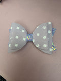 Purple floral bow